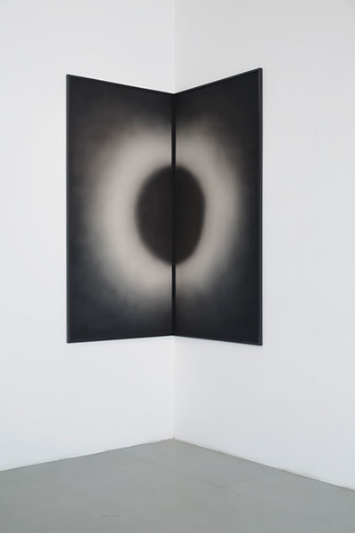 Sun meeting the moon in a corner  half cut black circle and half cut white circle in darkness, 2016